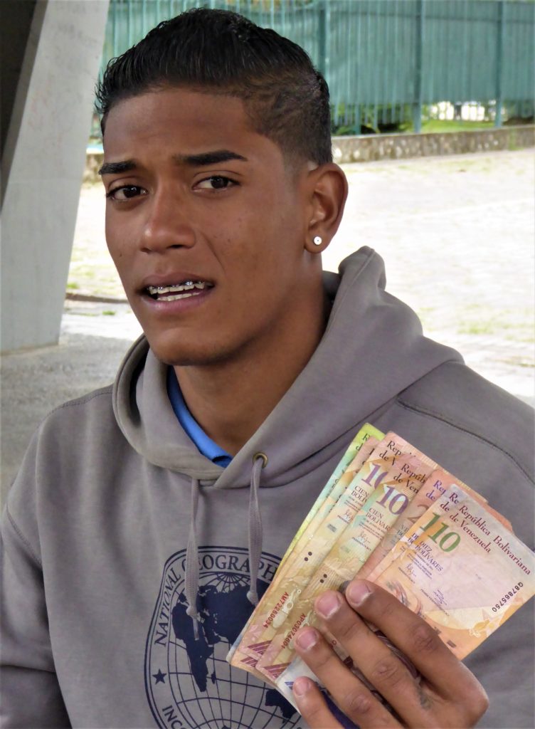  Jose Gregory, from Caracas, sells worthless Venezuelan banknotes as souvenirs.  He plans to move on to Peru