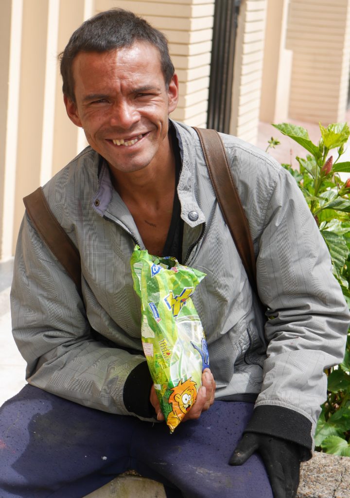 William sells sweets. He has lived on the streets since childhood.