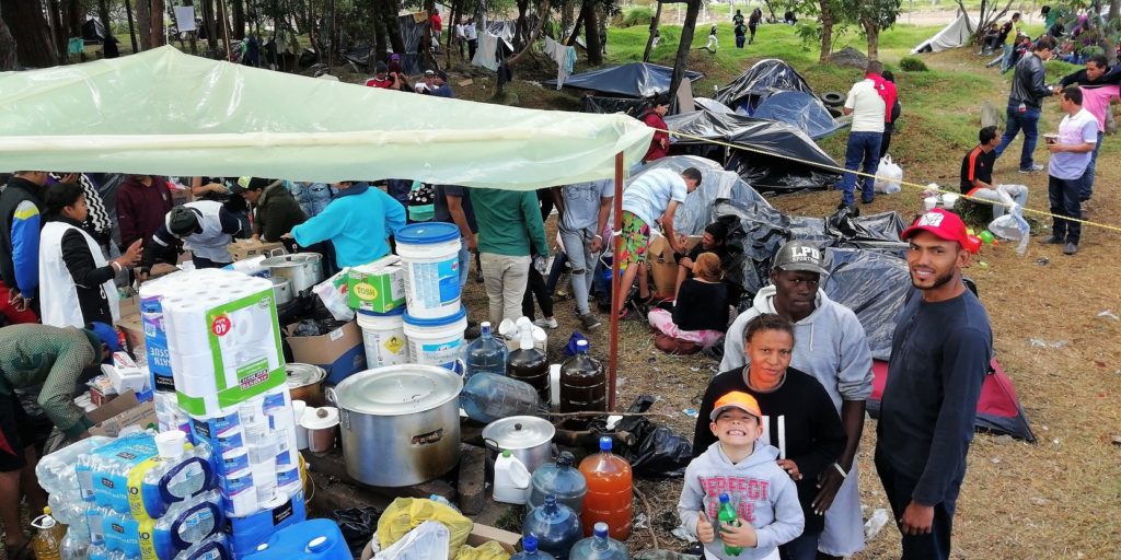 Open air kitchen at a makeshift migrant camp close to Salitre in Bogotá, it was later shut by the authorities. 