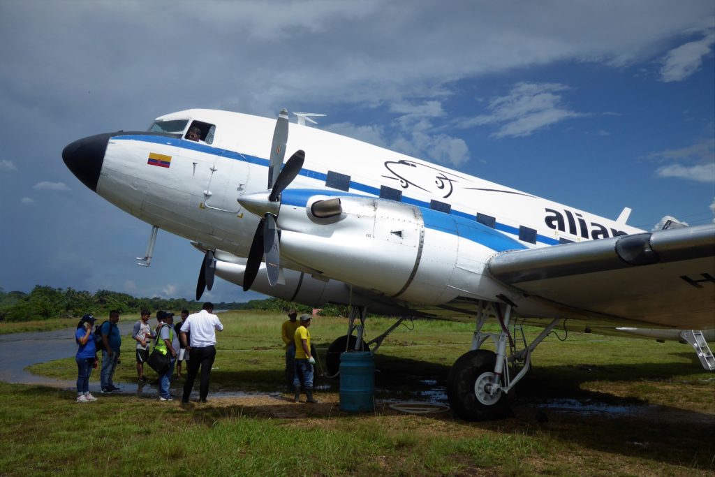 A DC-3 at La Pedrera airstrip in Amazonas. It's fitted with Pratt and Whitney turbo prop engines, much more advanced than than the old  Twin Wasp radial piston motors. But the sound is just not the same... 