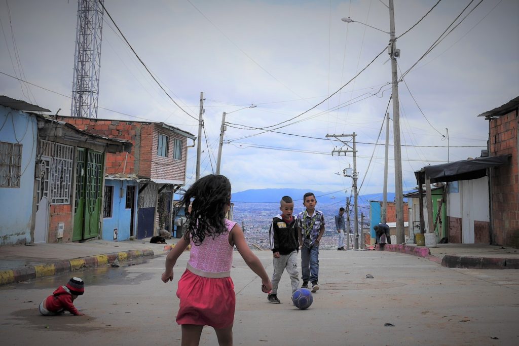 Kids having a kick-around in Barrio Bellaflor. The city is far down the mountain, and this Andean ridge catches the chill wind even when the sun is shining. Many families arrived in recent decades pushed out of other areas by conflict violence. Even here, there are security problems: armed gangs run extortion rackets, there small-scale drug trafficking and  petty crime. But there is also strong community spirit and  people told us that the area is constantly improving. 