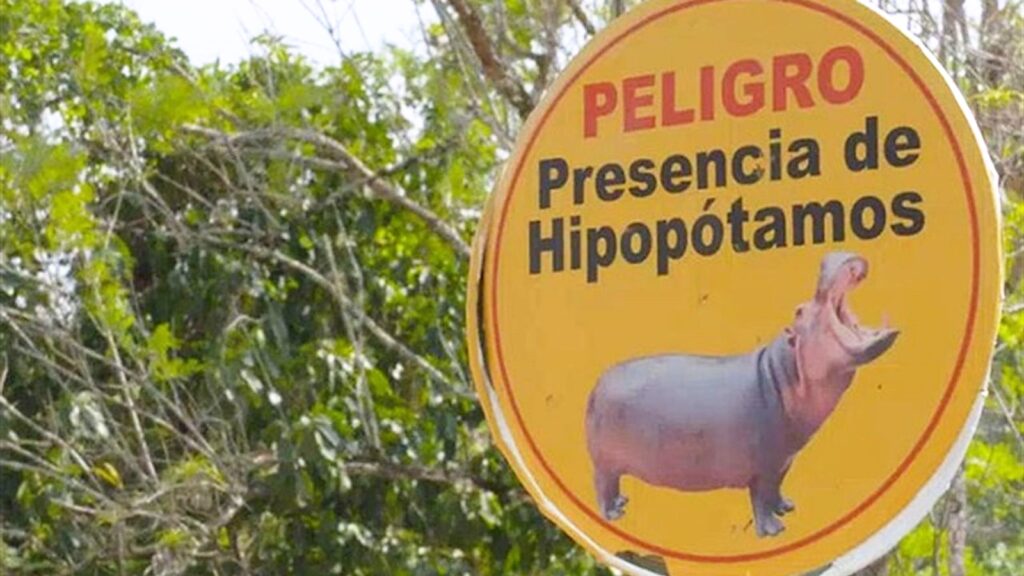 Beware of hippos: signs warning the general public.