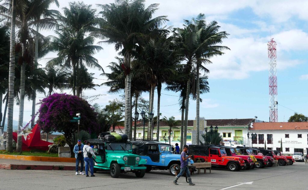 Salento's main plaza, with jeeps that form the local rural transport.